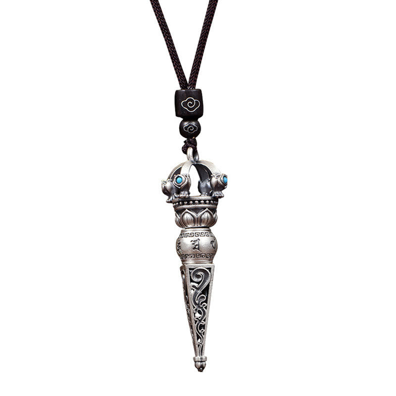 Tibetan Dorje Vajra Rotatable Pendant – Silver vajra with turquoise inlays, filigree scrollwork and Buddhist motifs on dark cord, white background straight-on view