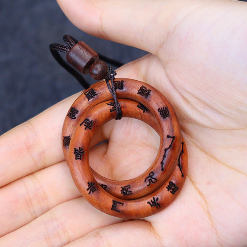 Qiankun Circle Necklace – Hand-held double-ring wooden pendant with black engraved Chinese characters and Big Dipper constell