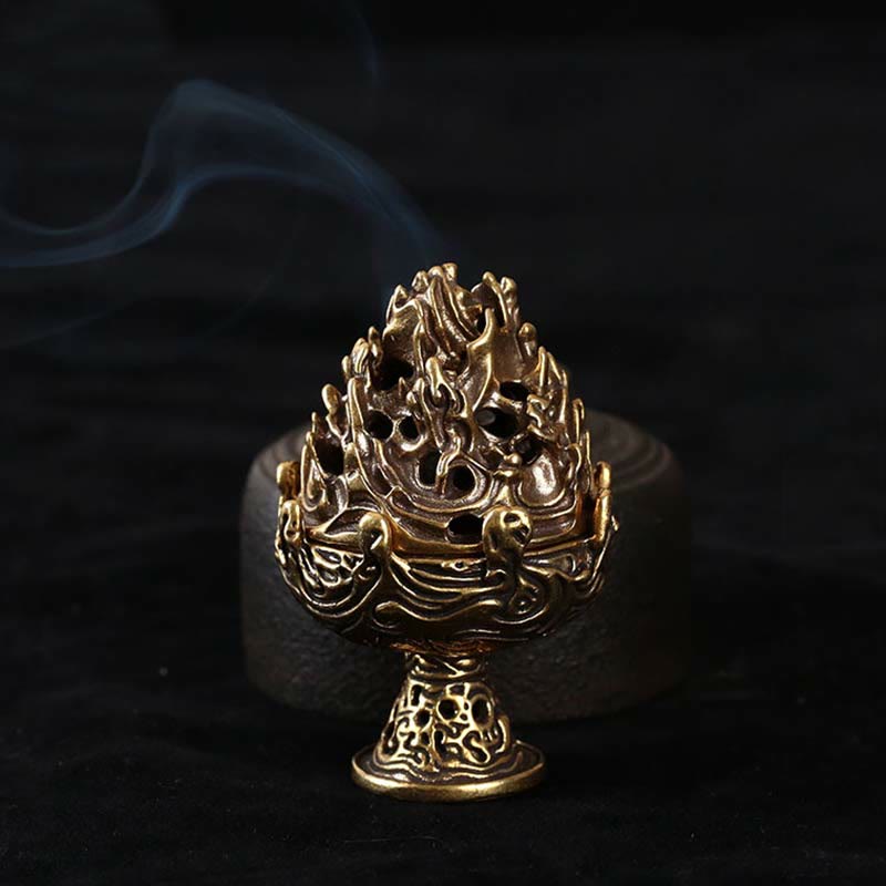 Copper Incense Burner with Skull Base – Front view showing openwork mountain lid and skull-motif pedestal, active smoke