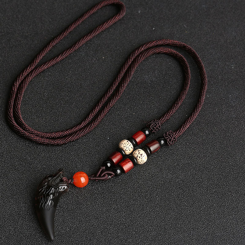 Colgante de collar con diseño de diente de lobo de obsidiana de hielo natural con valor