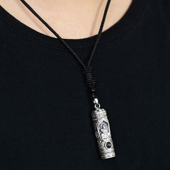 Chinese Zodiac Natal Buddha Projection Necklace – Silver cylinder pendant worn on black cord, model close-up, spiritual protection