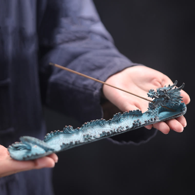 Dragon Alloy Incense Burner - Teal patina dragon with wave carvings held in hands, spiritual