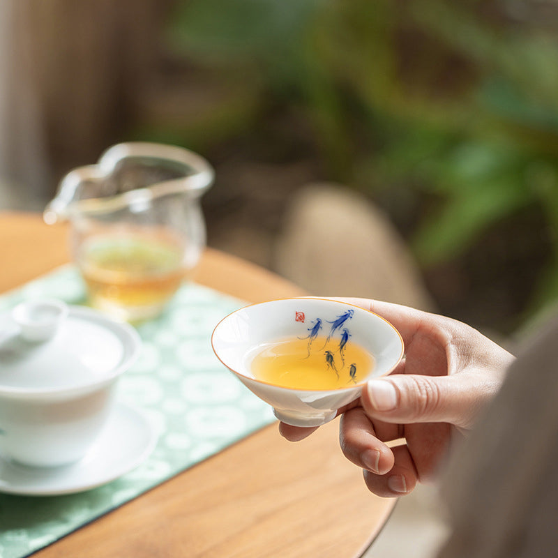 Mandala Koi Teacup – Bird and persimmon motif close-up on ceramic body, Chinese tea
