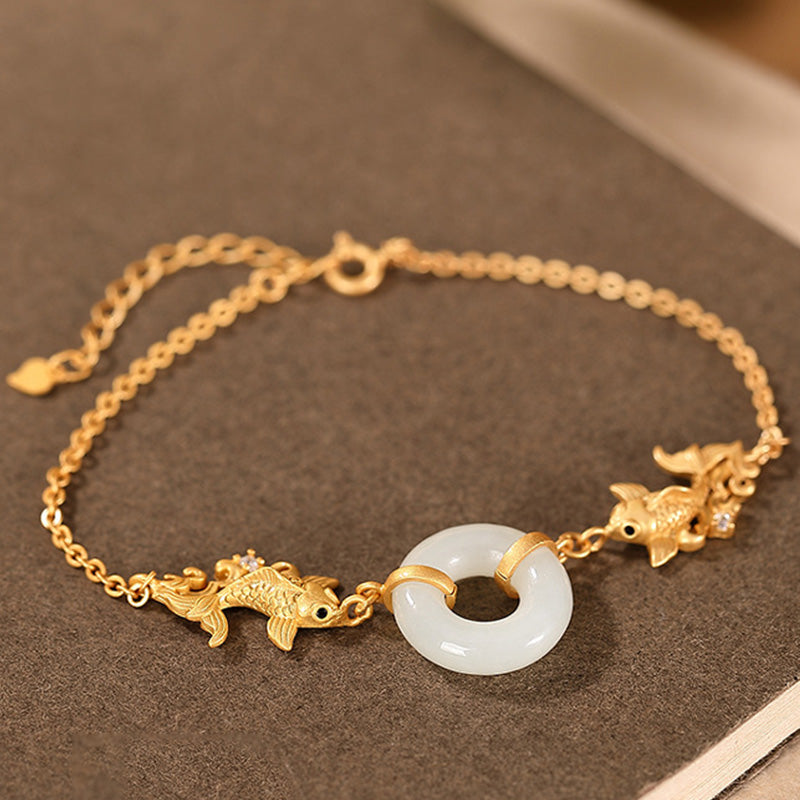 White Jade Koi Bracelet – displayed in silk pouch with decorative tassel, gift ready