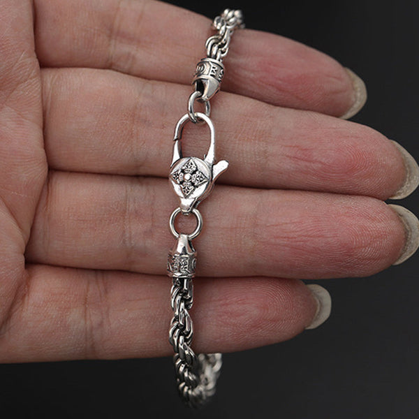 Silver Mantra Bracelet – worn on wrist with ornate floral clasp, oxidized silver, men's jewelry
