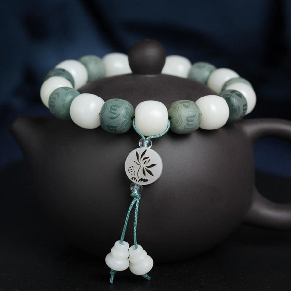 White Bodhi Seed Om Mani Padme Hum Bracelet – On Yixing teapot with lotus pendant, bodhi bead mala