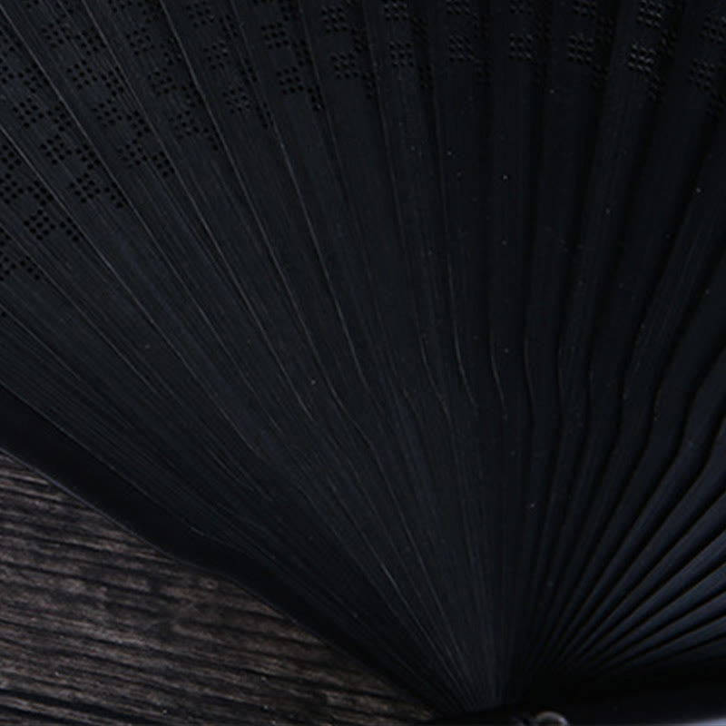 Plum Blossom Ink Fan – Black folding fan with ink wash plum blossoms on weathered wood, Chinese fan