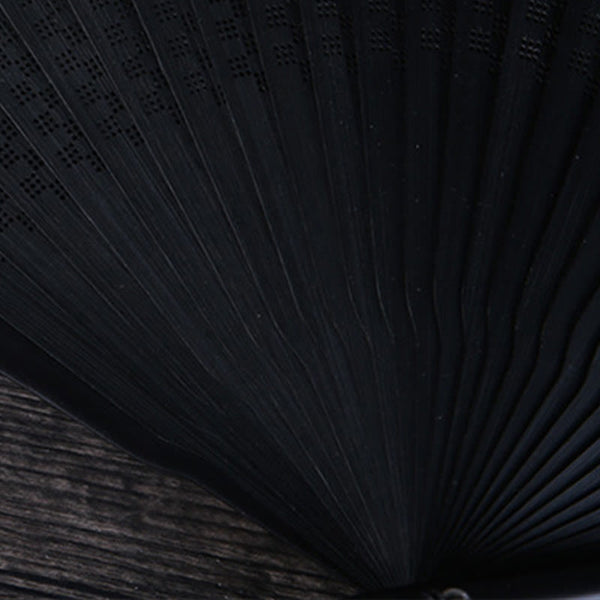 Plum Blossom Ink Fan – Black folding fan with ink wash plum blossoms on weathered wood, Chinese fan
