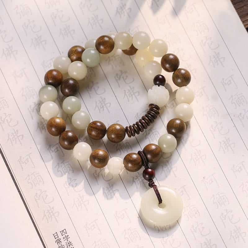 Bodhi Seed Sandalwood Lotus Bracelet - dual-strand white jade and wood beads on Buddhist sutra paper
