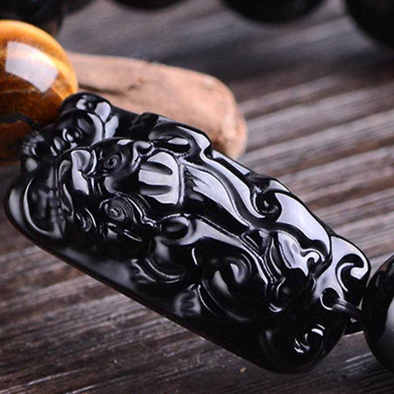 Black Obsidian PiXiu Tiger Eye Bracelet three-photo collage, ceramic and wood props, feng shui amulet views