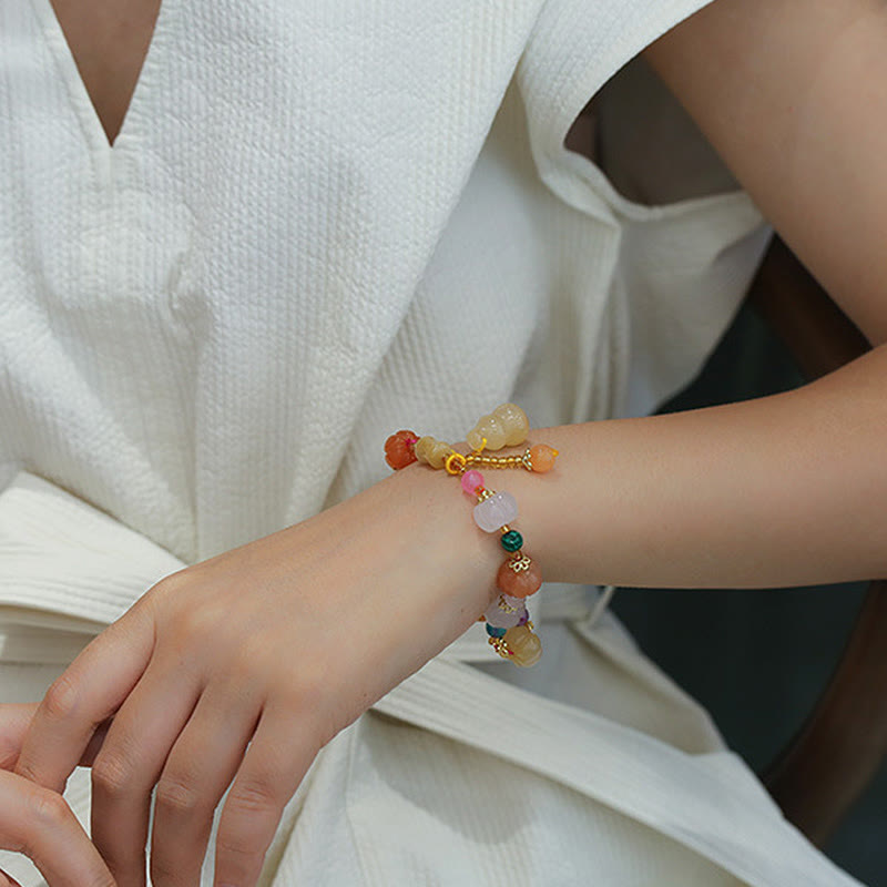 Golden Silk Jade Gourd Bracelet – Bracelet worn on woman wrist with white blouse