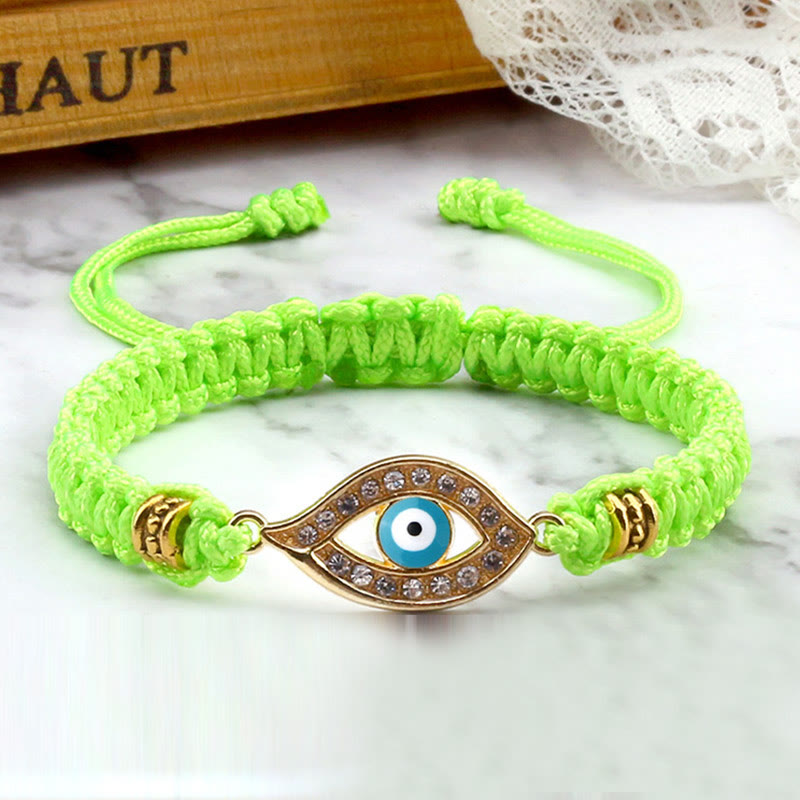 Neon green cord evil eye bracelet with gold evil eye crystal pave charm, marble styling