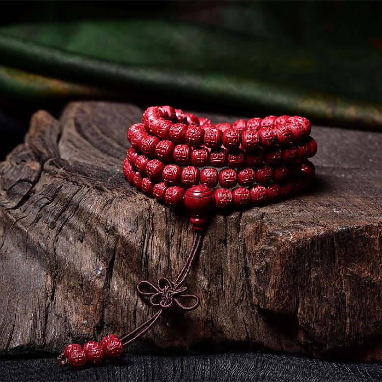 108 Mala Beads Cinnabar Bracelet – Coiled with tassel drop on driftwood, red beads