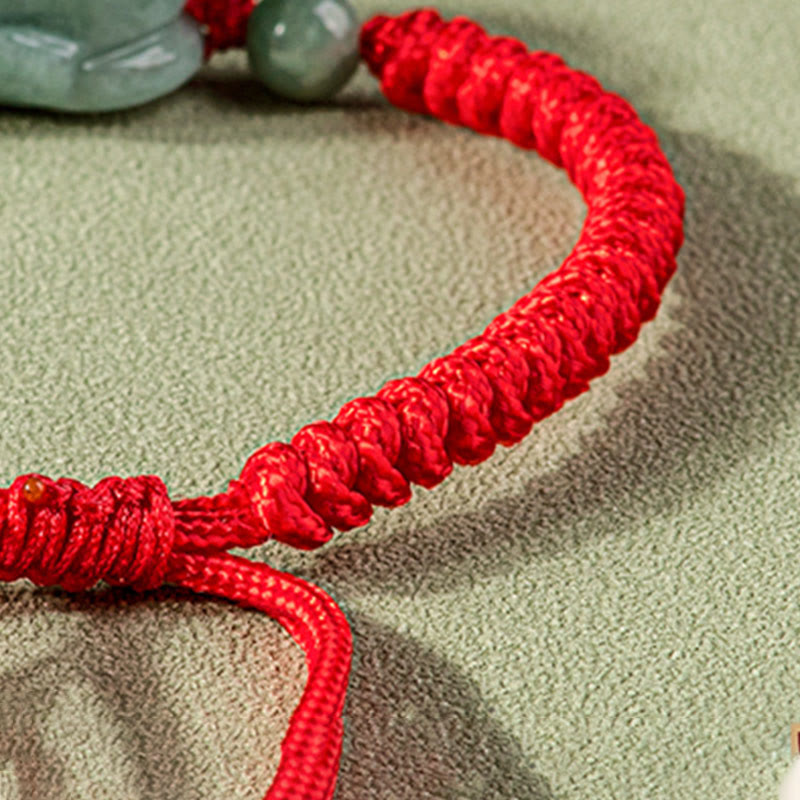 Jade PiXiu Knot Bracelet – Detail of red braided bracelet band with jade bead and PiXiu charm
