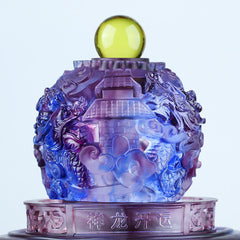 Liuli Dragon Crystal Sphere – Translucent purple orb with pagoda and dragon relief on dark surface, Prosperity