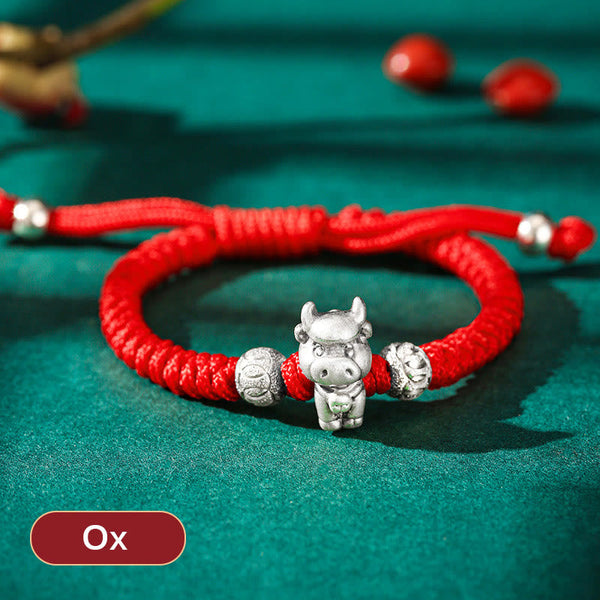 999 Sterling Silver Zodiac Red Rope Kids Bracelet - Silver ox figure on red braided cord with embossed beads, zodiac keepsake