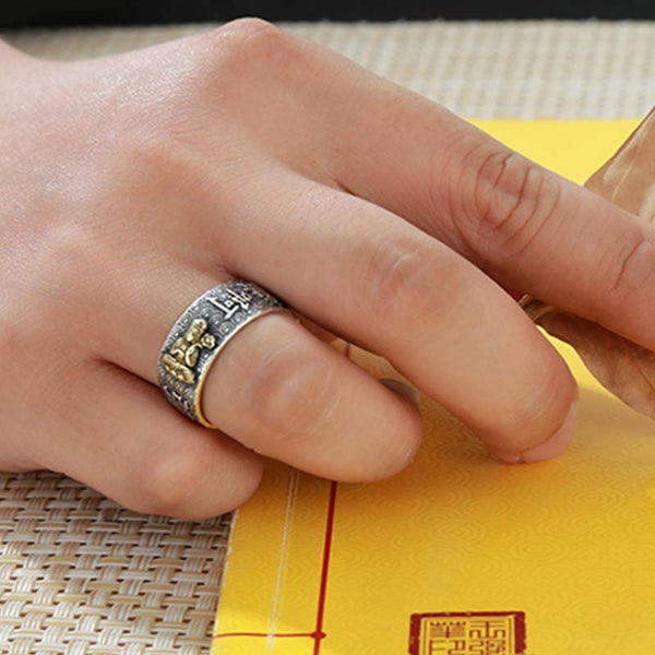 Natal Buddha Ring - Worn on finger with red seal traditional background, Lucky