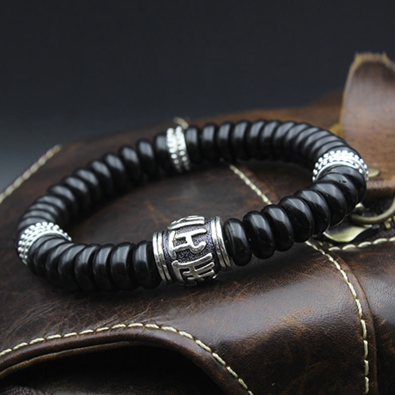Om Mani Padme Hum Coconut Shell Bracelet – side angle on leather, dark brown bead bracelet