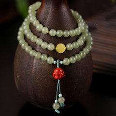 Jade Amber Buddha Bracelet - Worn on wrist display, prosperity red agate jewelry