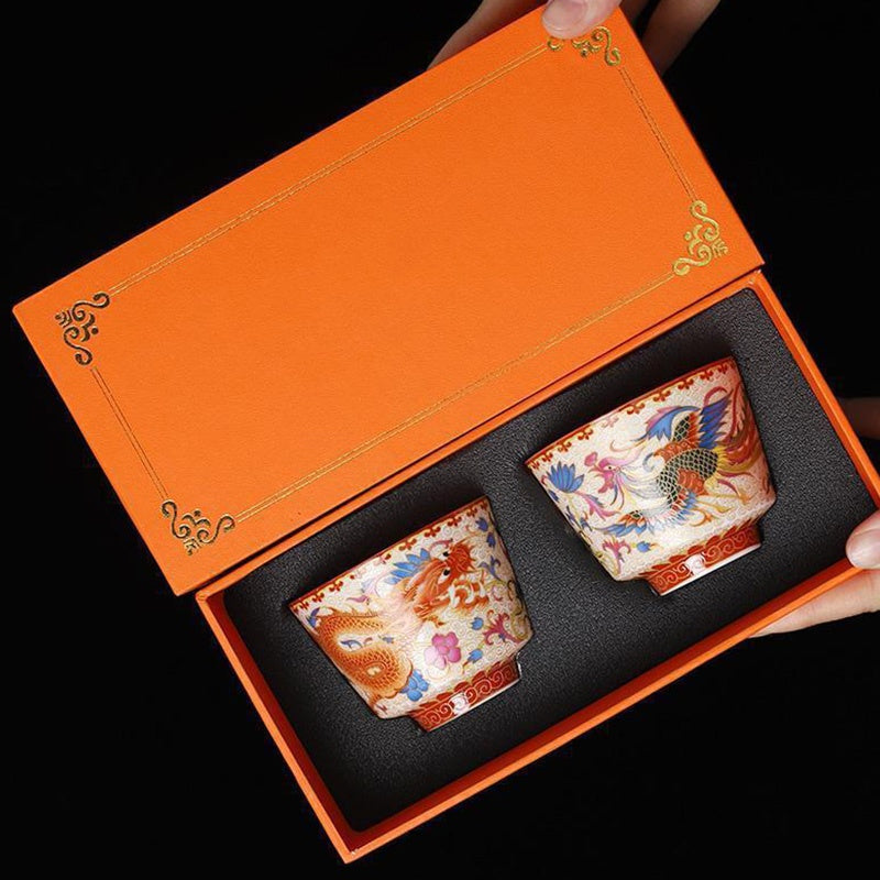 2Pcs Dragon Phoenix Ceramic Teacup Set - Paired teacups in velvet-lined orange box, auspicious