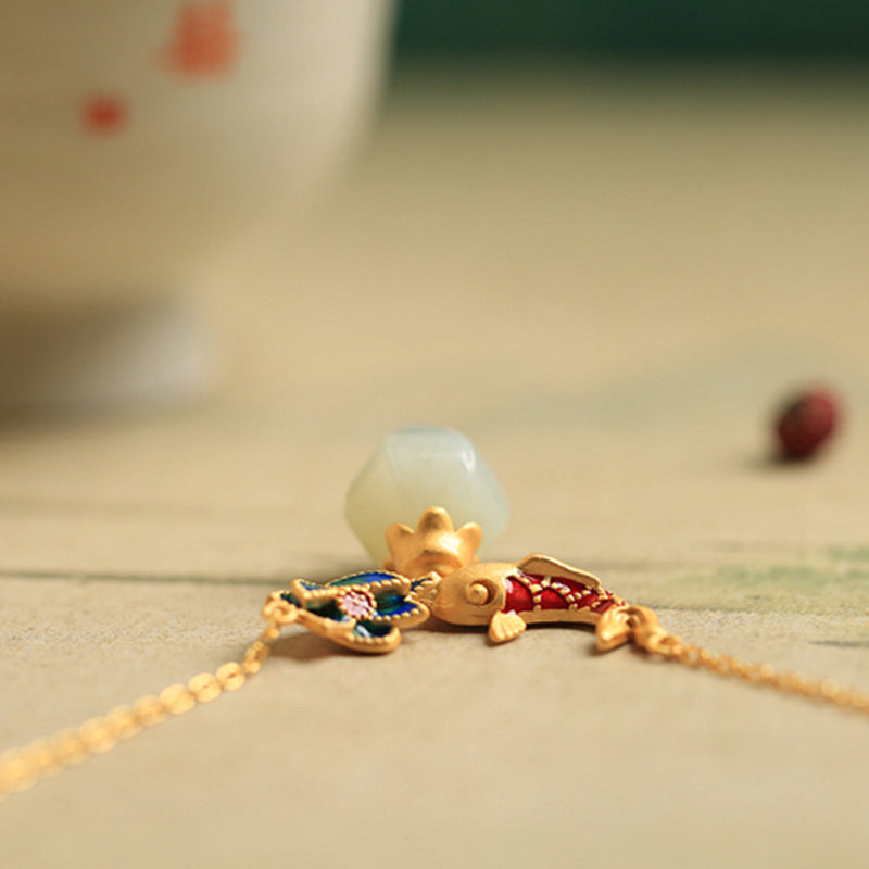 White Jade Koi Fish Necklace – gold koi pendant with red enamel and blue flower charm on beige, Asian luck necklace