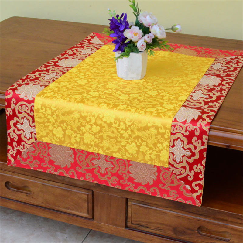 Dragon Vajra Altar Table Runner – Yellow red brocade on wood table with flowers, festive