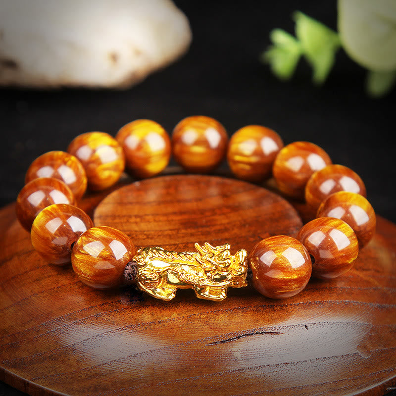 Golden Tiger Eye Bracelet – Detailed close-up on wooden display, prosperity bracelet