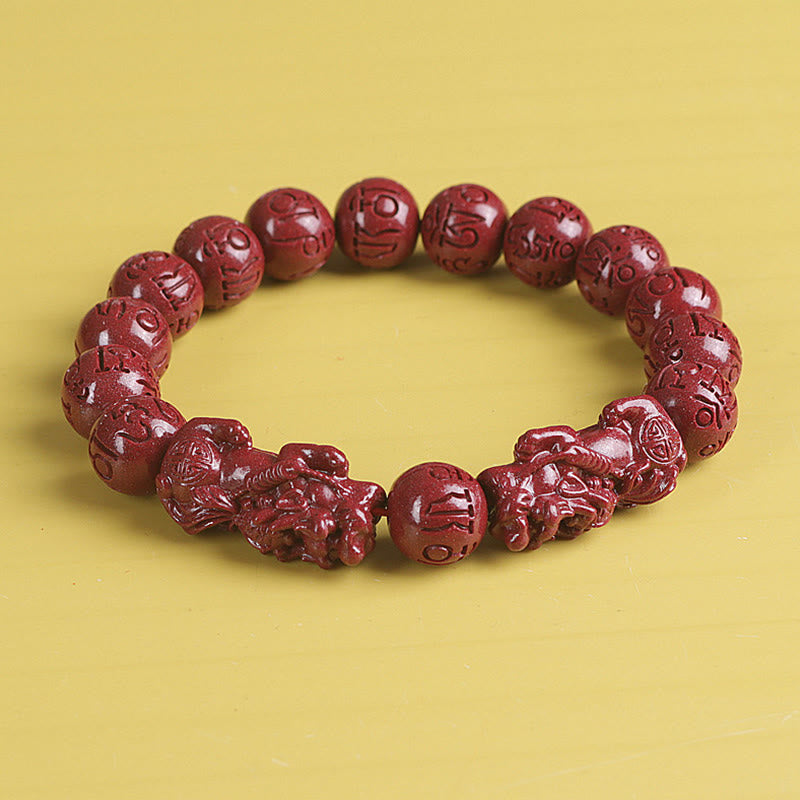 Double PiXiu Cinnabar Bracelet – Front view red cinnabar beads with detailed PiXiu carvings, wealth bracelet