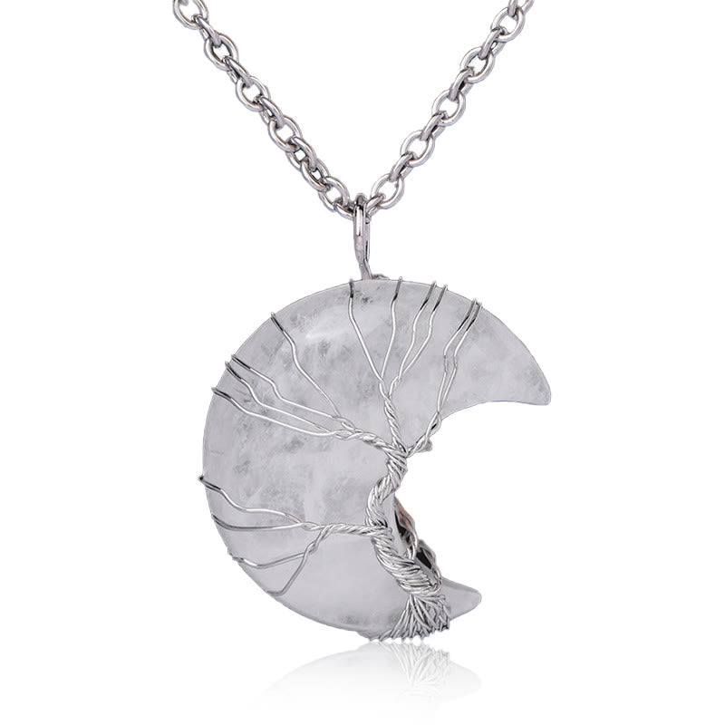 Quartz Crystal Moon Tree of Life Pendant – clear quartz crescent with silver wire tree on white, healing crystal necklace