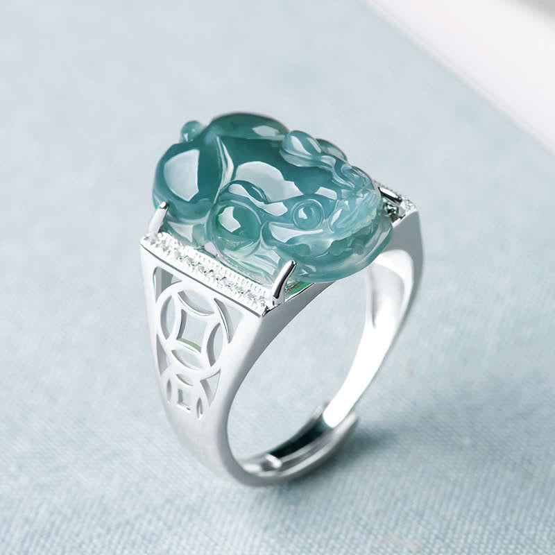 925 Sterling Silver Jade PiXiu Luck Ring – Blue-green jade PiXiu on silver band with diamonds, light blue fabric