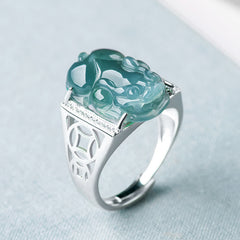 925 Sterling Silver Jade PiXiu Luck Ring – Blue-green jade PiXiu on silver band with diamonds, light blue fabric