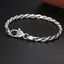Silver Rope Chain Bracelet – twisted wheat chain with crystal clasp on dark surface, sterling silver bracelet