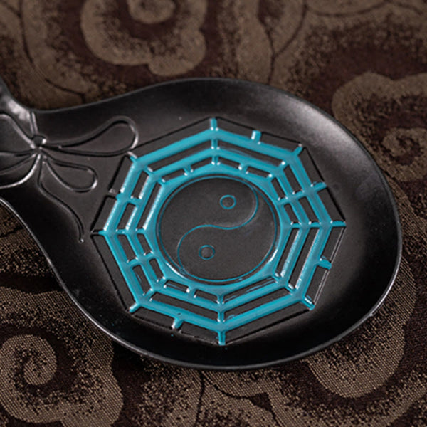 Gourd Yin Yang Bagua Incense Burner – Black dish with turquoise Bagua and yin-yang symbol on fabric, copper burner