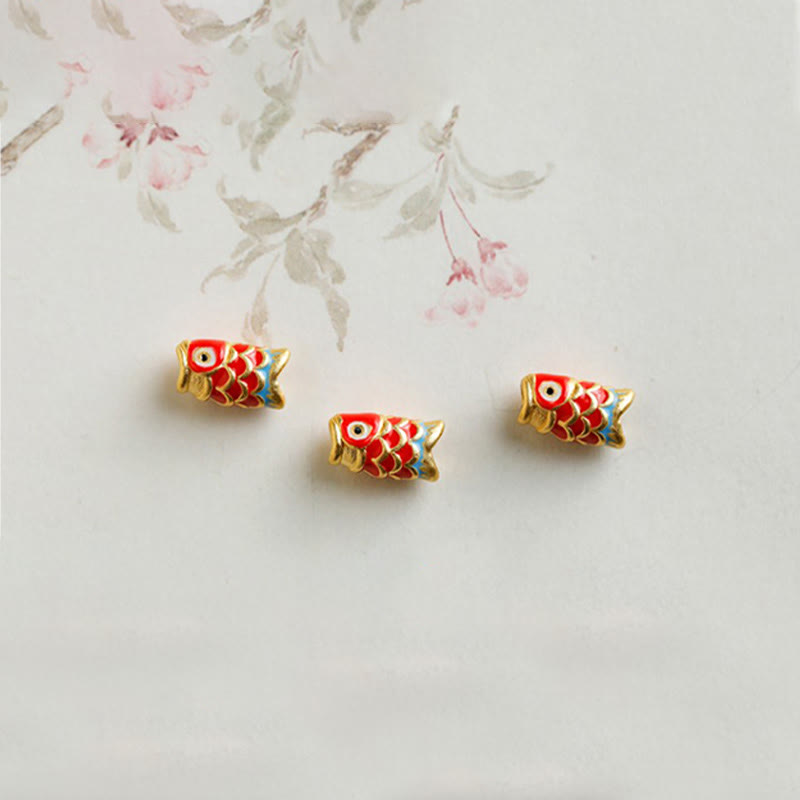 999 Gold Koi Fish Bracelet – bracelet coiled in circle, garnet bead pattern, gold koi protection talisman