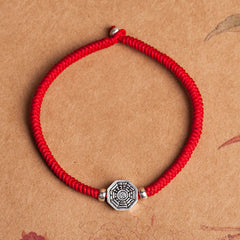 925 Sterling Silver Yin Yang Bagua Cinnabar Bracelet – Red braided cord with octagonal Bagua charm, adjustable knot, flat lay