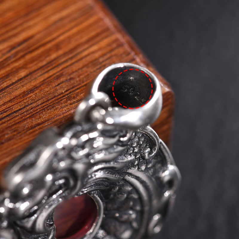 Koi Fish Dragon Amulet - comparison view with coin for size reference, peace buckle