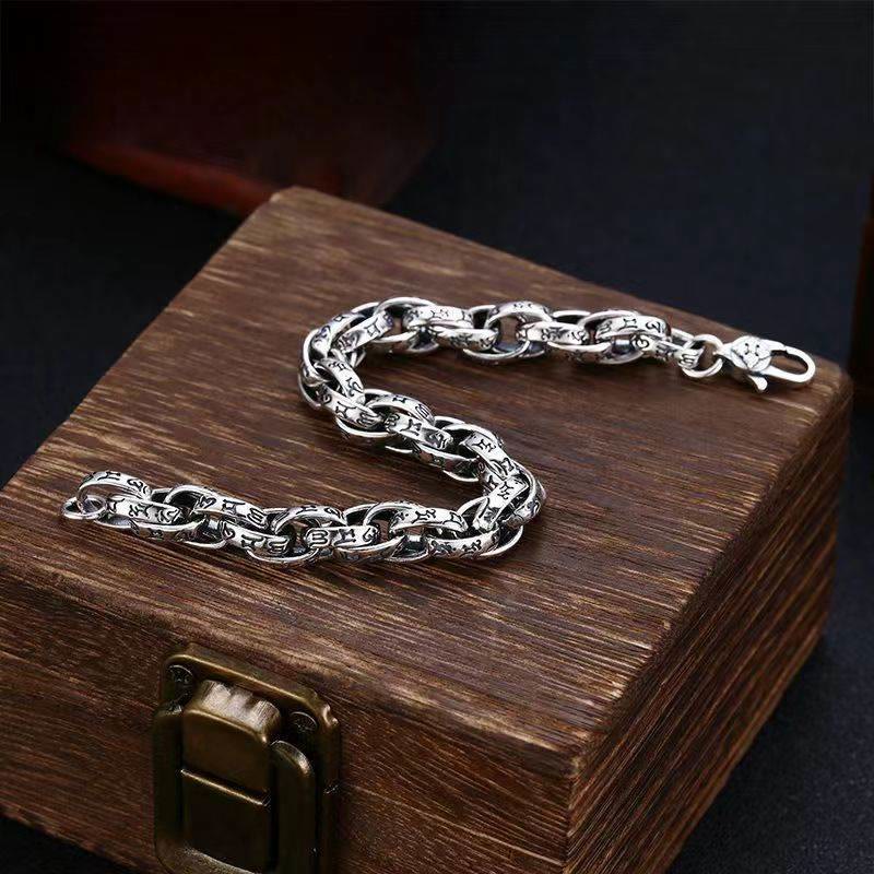 Tibetan Om Mani Padme Hum Copper Bracelet – detailed engraved links on dark wood box, artisan bracelet