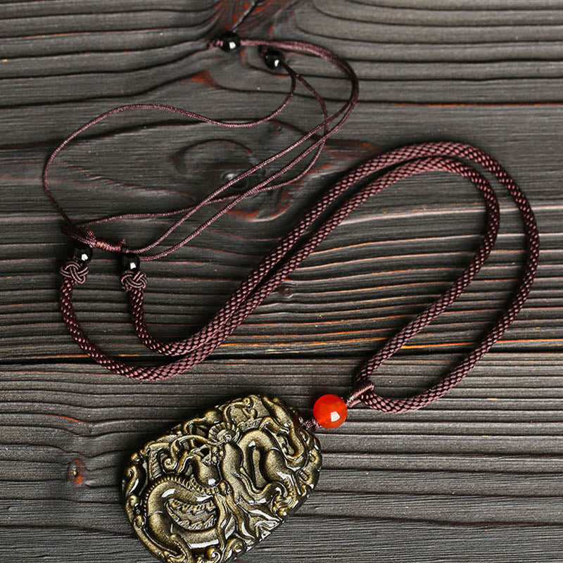 Gold Sheen Obsidian Dragon Pendant – Elevated angle showing metallic gold luster across dragon scales, wealthy