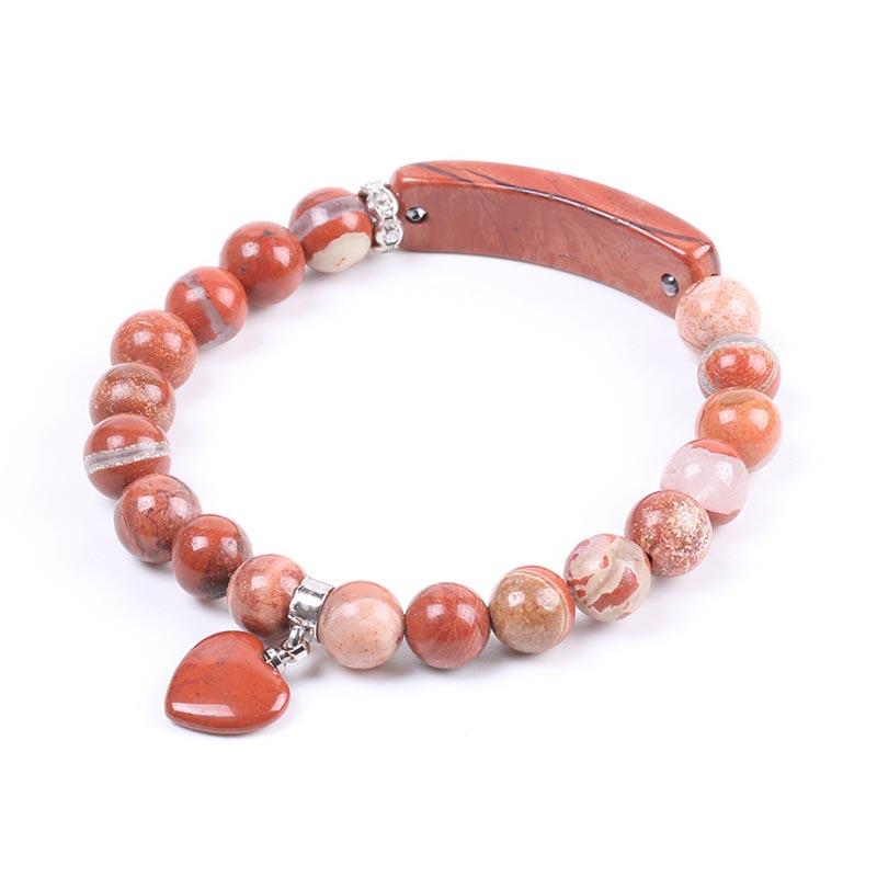 Natural Multi-Stone Love Heart Healing Bracelet - Red jasper variant with rust-red and terracotta beads, cream banding, curved bar centerpiece, and heart charm