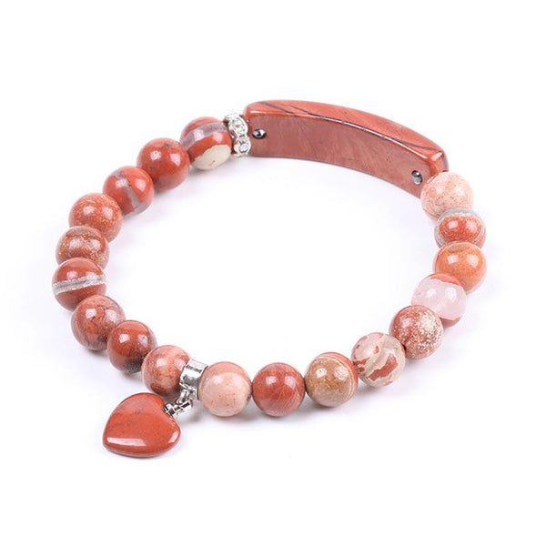 Natural Multi-Stone Love Heart Healing Bracelet - Red jasper variant with rust-red and terracotta beads, cream banding, curved bar centerpiece, and heart charm