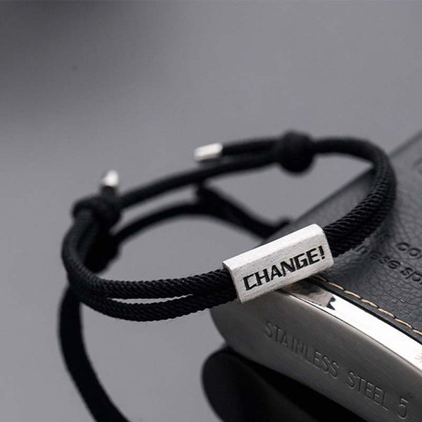 925 Sterling Silver Letter Blessing String Bracelet – Black braided cord with silver engraved CHANGE inspirational word bar on stainless steel display stand