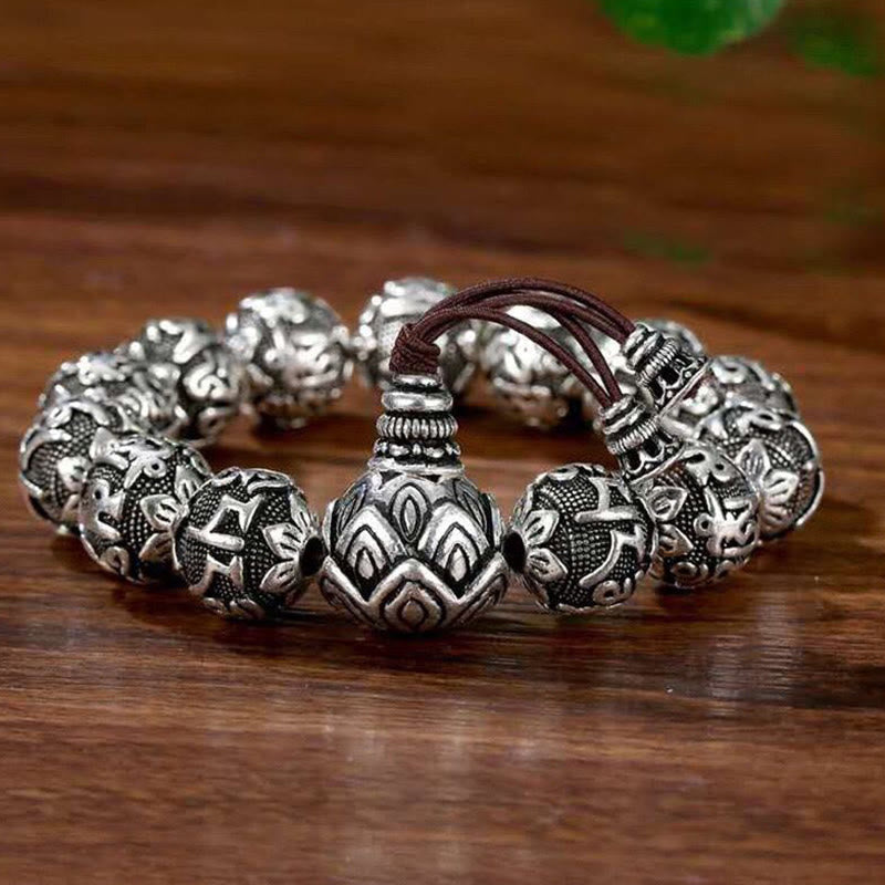 Om Mani Padme Hum Bracelet – Single silver mantra bracelet on wood, lotus guru bead