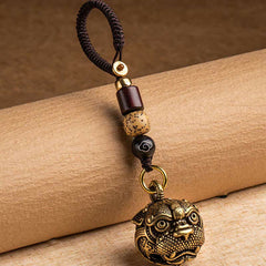 Pixiu Wealth Copper Key Chain – on bamboo scroll side view, brown cord and brass pixiu head charm detail