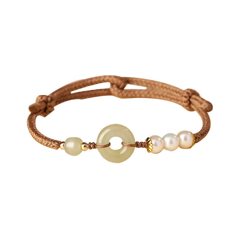 Hetian Jade Pearl Peace Buckle Bracelet – jade bi disc with pearl and jade bead on brown cord, white background elevated front view