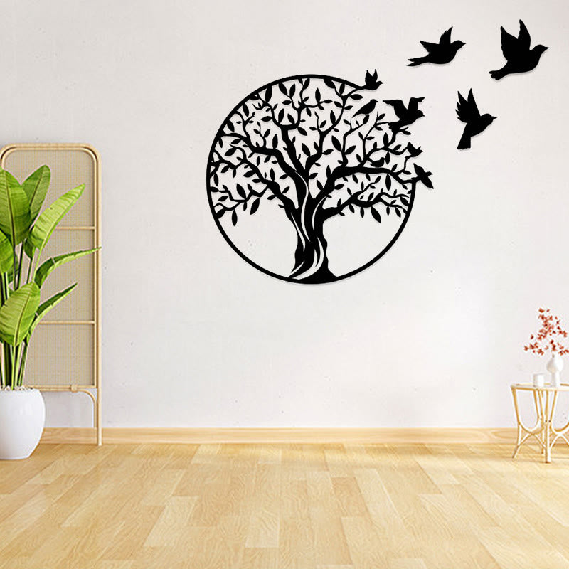 Tree of Life Birds Metal Wall Art - black tree with birds on white wall beside tall plant and bamboo screen