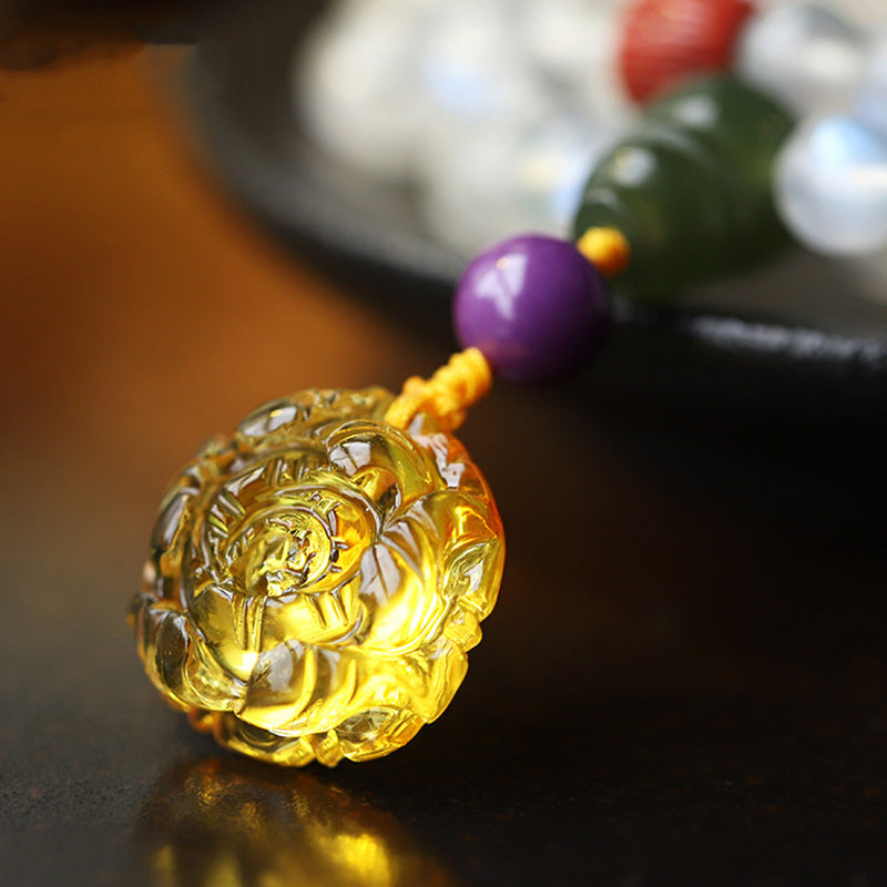 Moonstone Amber Turquoise Lotus Mala - Carved golden amber flower pendant with purple bead, macro detail