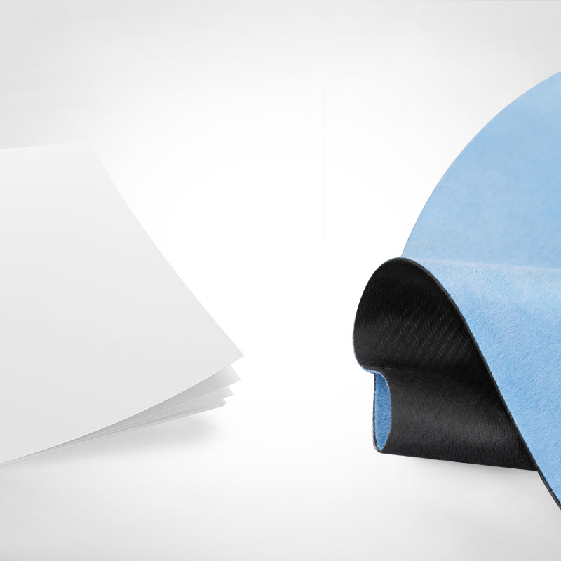 Lotus Mandala Yoga Mat – Blue mat roll with black rubber backing beside white protective film, material layers