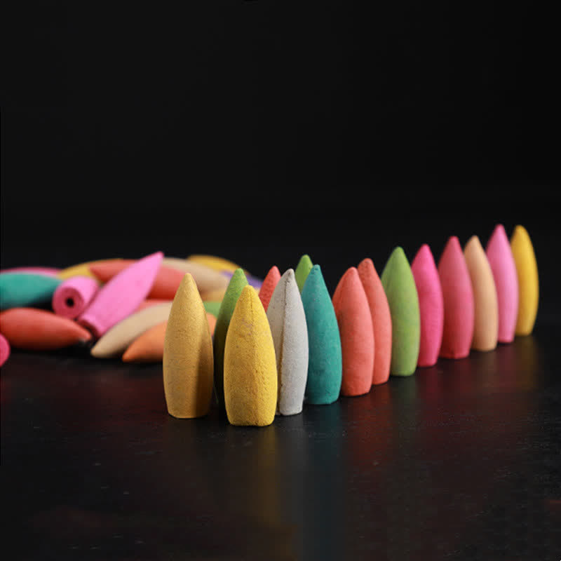 Floral Backflow Incense - Rainbow arc of cones on black surface, soothing