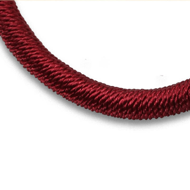 Tibetan Turquoise Om Mani Padme Hum Braided Bracelet – Close-up of burgundy braided cord texture on white background, hand...