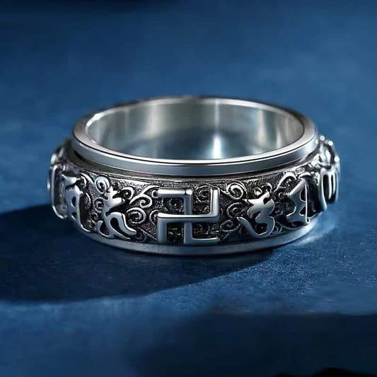Swastika Copper Rotatable Ring – Oxidized silver band with swastika and Sanskrit symbols, meditation ring